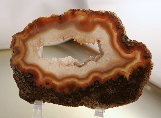 Laguna Agate Slab with open center from Ojo de Laguna is a marvel of nature. With its distinct features including a translucent formation and clear druzy crystals