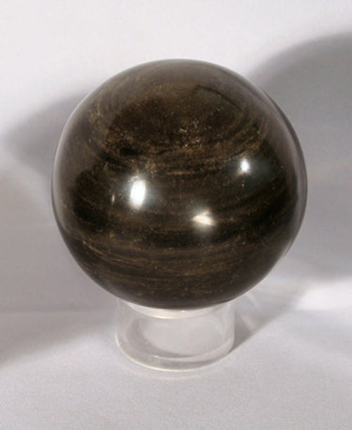 Sphere on stand showing gold sheen variation.