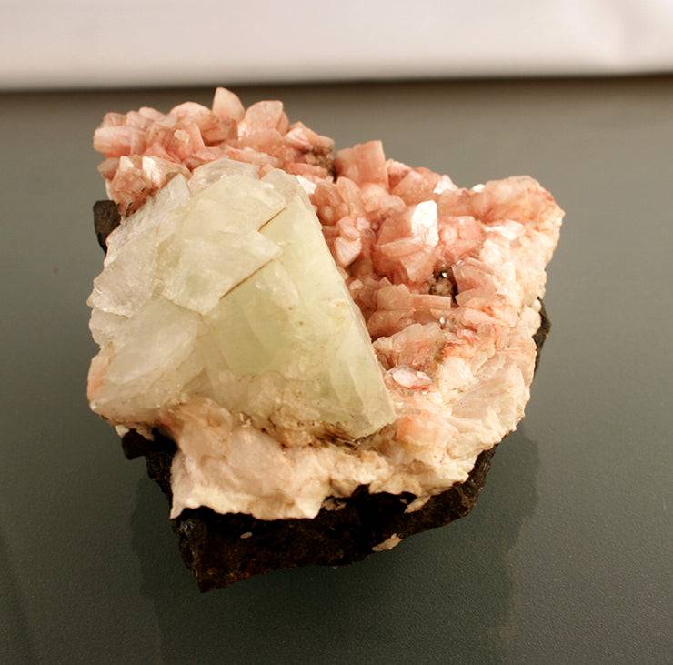 Apophyllite on pink Heulandite crystals closeup