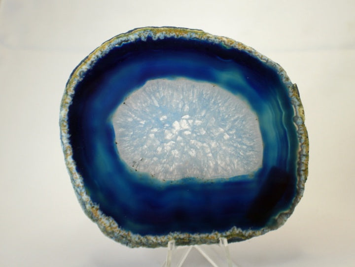 Agate slab showing blue banding and solid crystal center