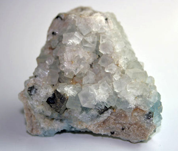 10088 front view clear and blue fluorite with single cube of galena