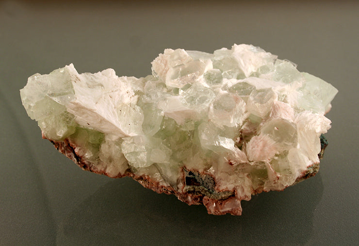 Gyrolite on Apophyllite crystals - front-grey backgroune