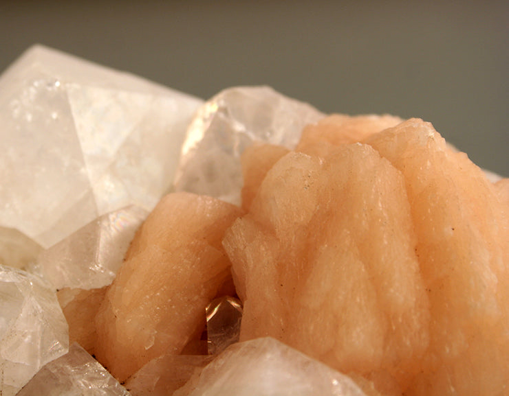 Closeup of stilbite cluster showing small apophyllite crystal