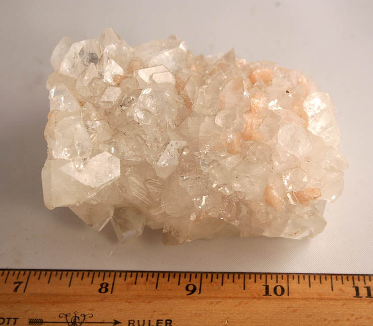 Appophylilte crystals dotted with peach stilbite - index