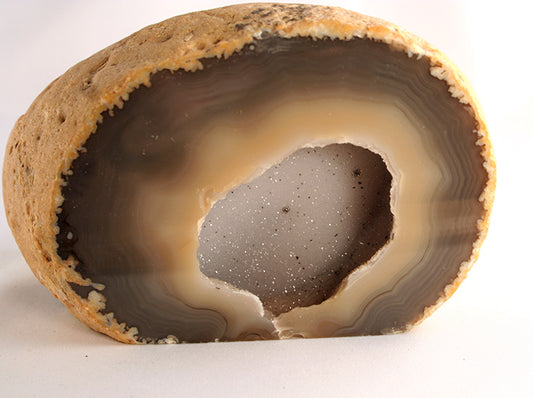Agate half with open hollow filled with crystals