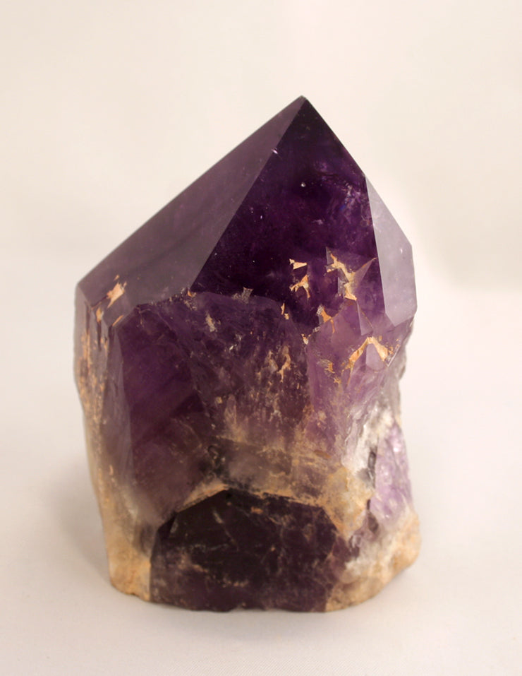 Amethyst crystal pillar showing side and base
